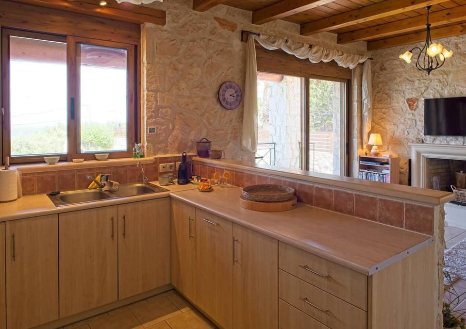 Villa | Private kitchen | Fridge, microwave, oven, stovetop