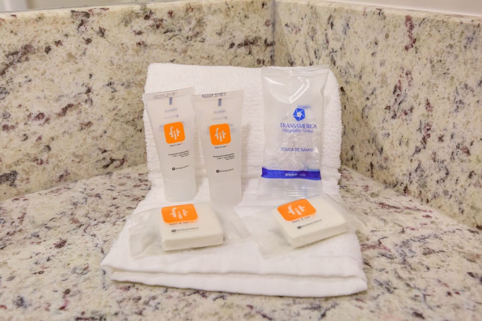 Shower, rainfall showerhead, towels, soap