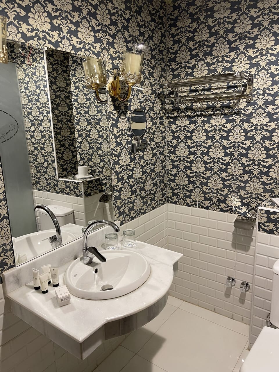 Shower, rainfall showerhead, hair dryer, towels