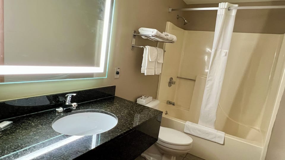 Suite, 1 King Bed, Non Smoking (Upgraded) | In-room safe, laptop workspace, blackout drapes, iron/ironing board