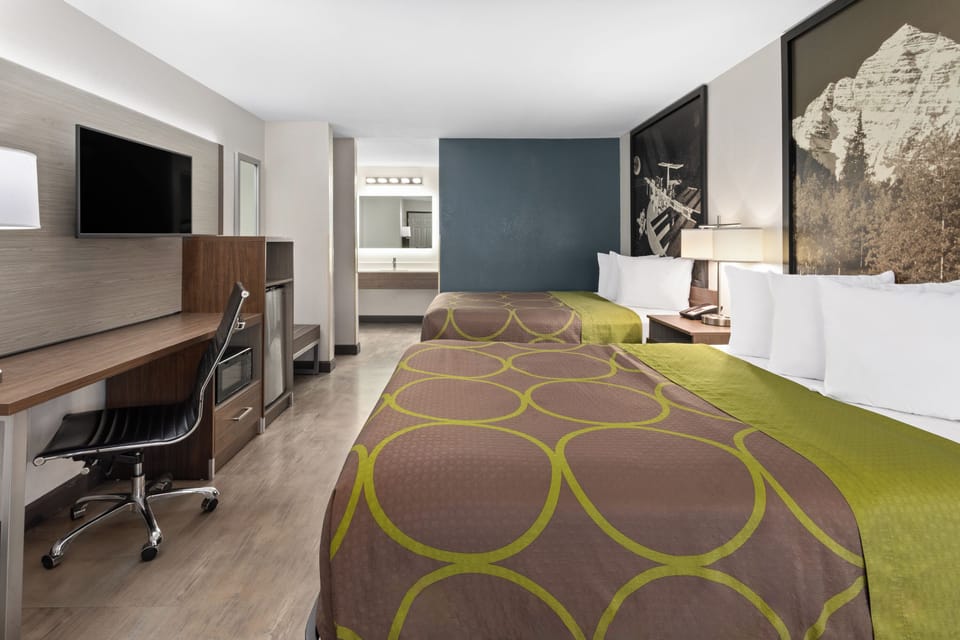 Standard Room, 2 Queen Beds | Iron/ironing board, free cribs/infant beds, free WiFi, bed sheets