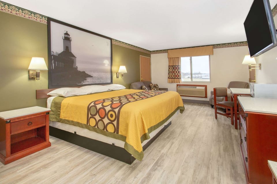 Desk, laptop workspace, blackout drapes, iron/ironing board