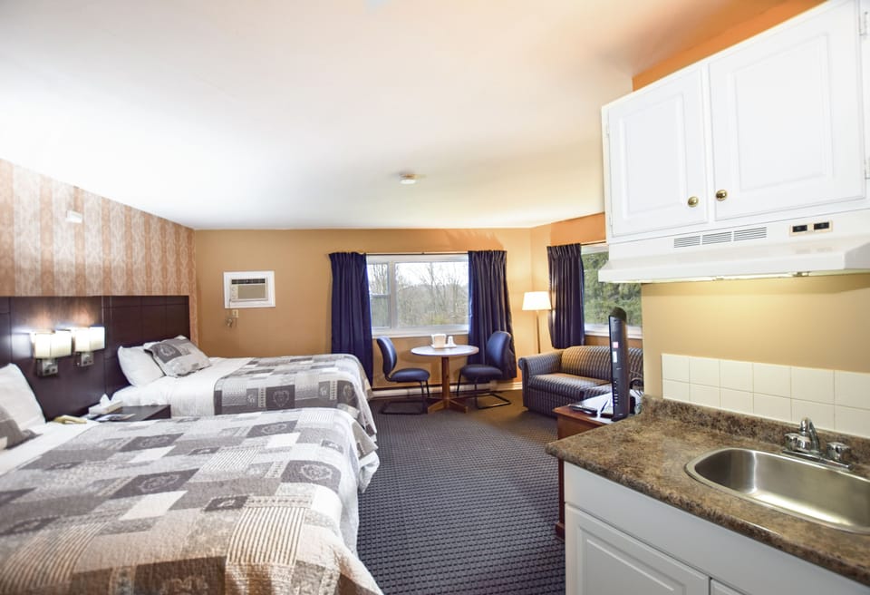 Room, 2 Queen Beds | Iron/ironing board (on request), WiFi (free), alarm clocks, bed sheets