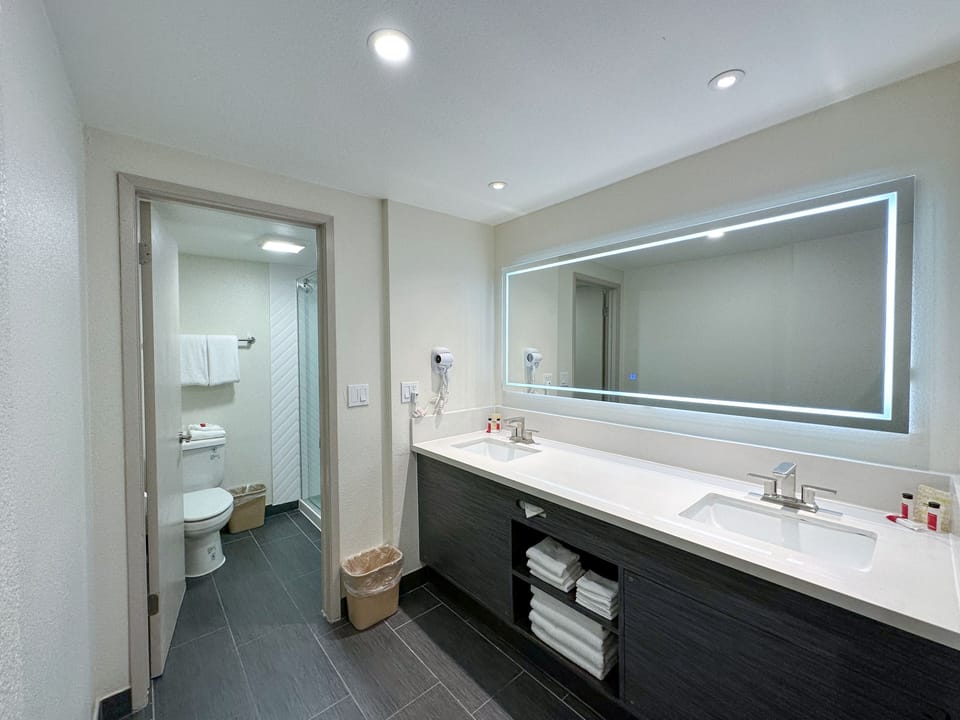 Room, Non Smoking (2 Queen Beds & 1 Bunk Bed) | Bathroom | Free toiletries, hair dryer, towels