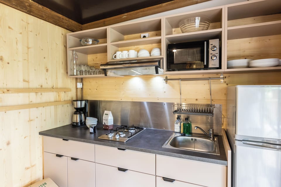 Family Chalet | Private kitchen | Stovetop, highchair, cookware/dishes/utensils, cleaning supplies