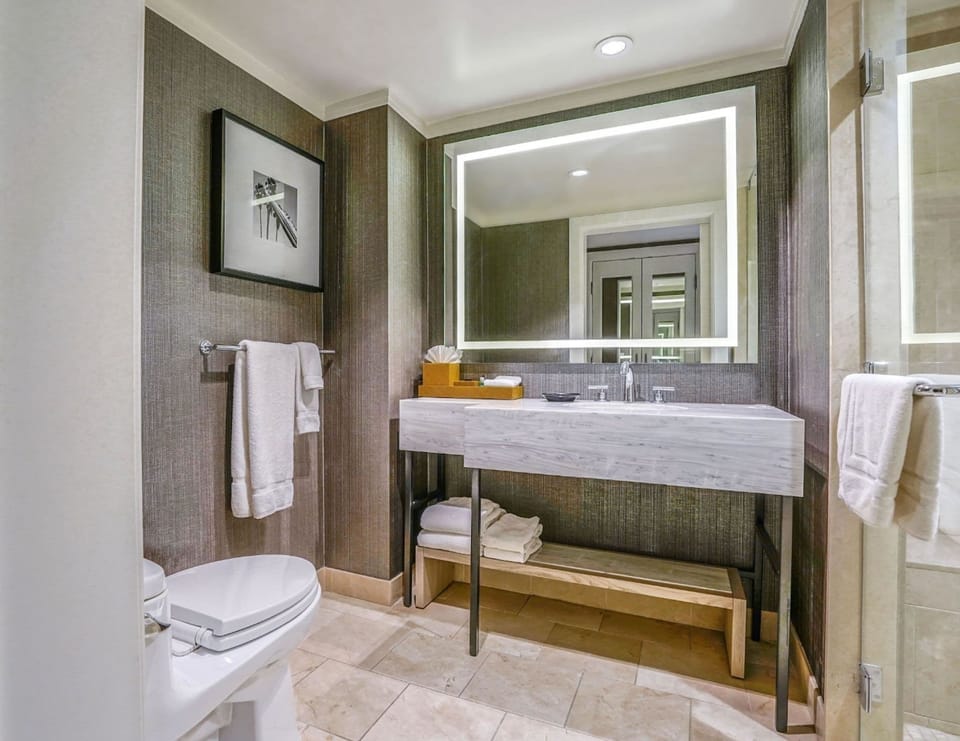Designer toiletries, hair dryer, bathrobes, towels