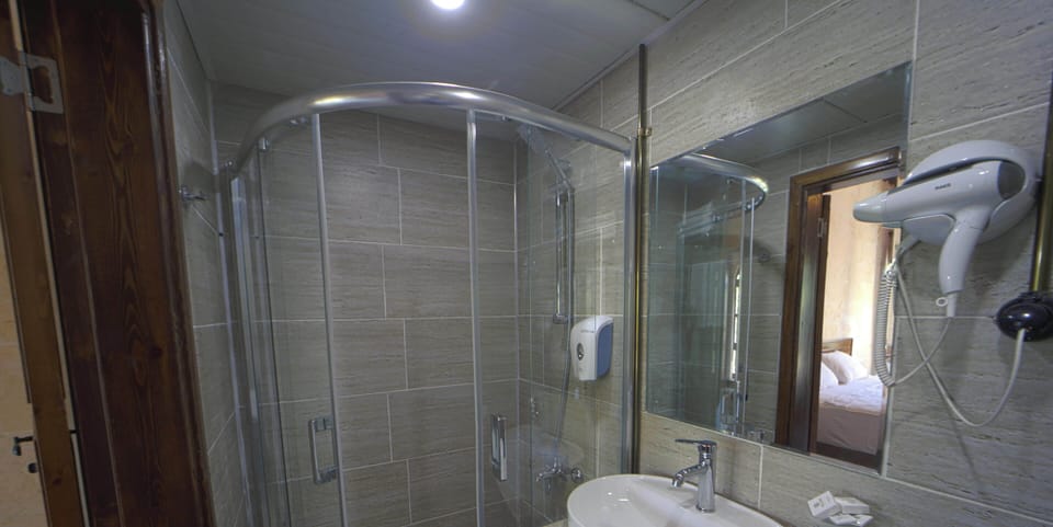 Standard Double Room | Bathroom | Hair dryer, slippers, towels, soap