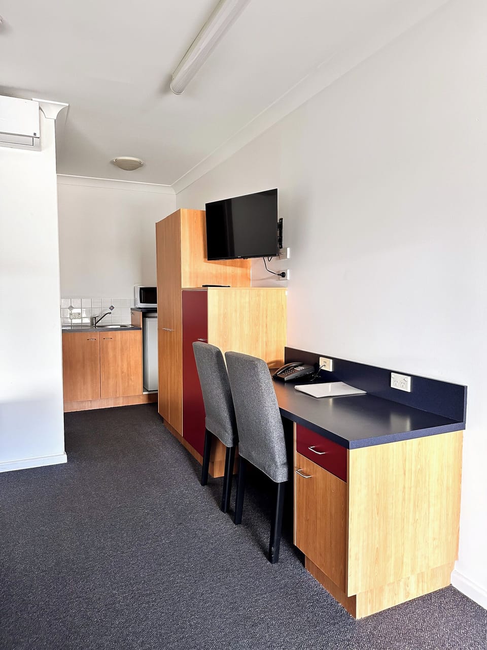 Desk, laptop workspace, blackout drapes, iron/ironing board
