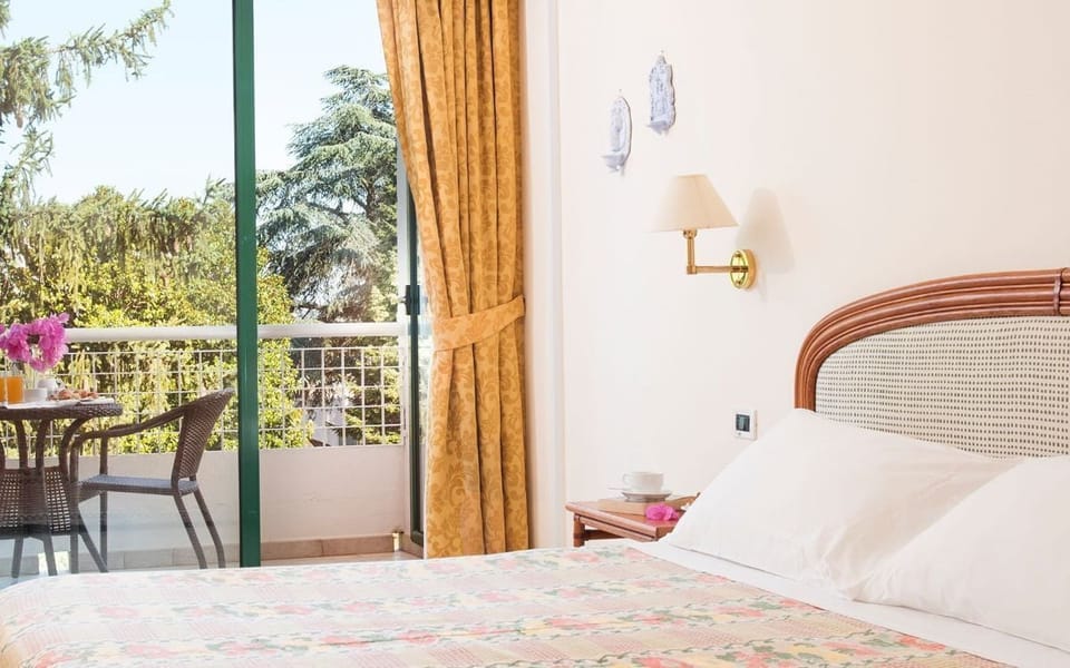 Standard Double Room | Minibar, in-room safe, desk, blackout drapes
