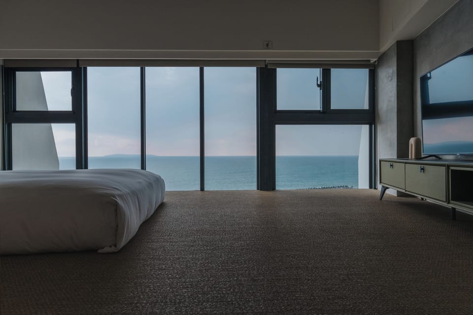 Signature Loft | Down comforters, blackout drapes, WiFi (free), bed sheets