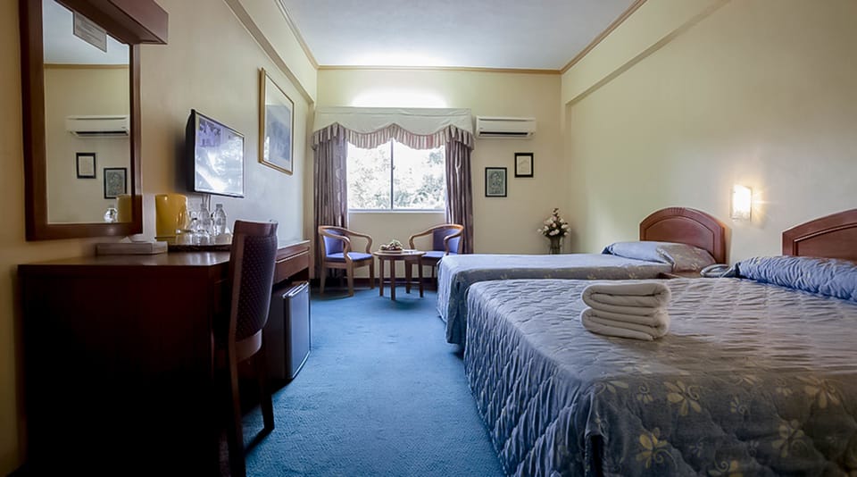 Family Room | Minibar, WiFi (free), bed sheets