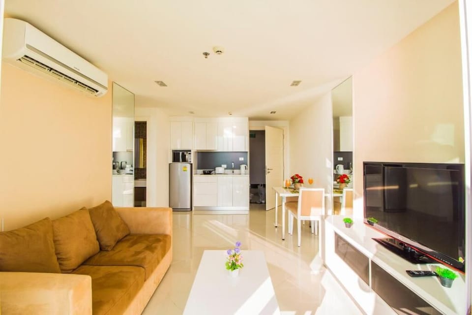 One Bedroom Apartment  | Living area | 40-inch plasma TV with cable channels, TV