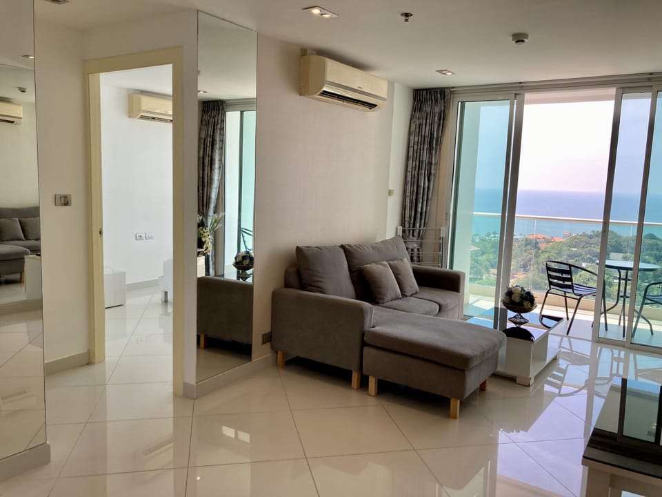 One Bedroom Apartment  | Living area | 40-inch plasma TV with cable channels, TV