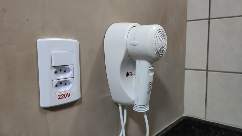 Apartment | Bathroom | Shower, rainfall showerhead, hair dryer, towels