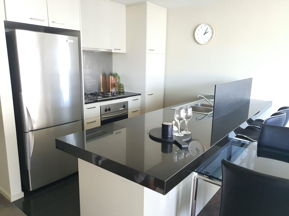 Deluxe Two Bedroom Apartment  | Private kitchen | Full-size fridge, microwave, oven, stovetop