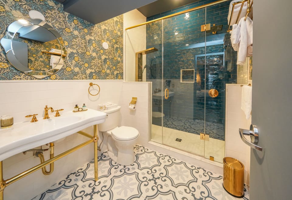 Shower, hydromassage showerhead, designer toiletries, hair dryer