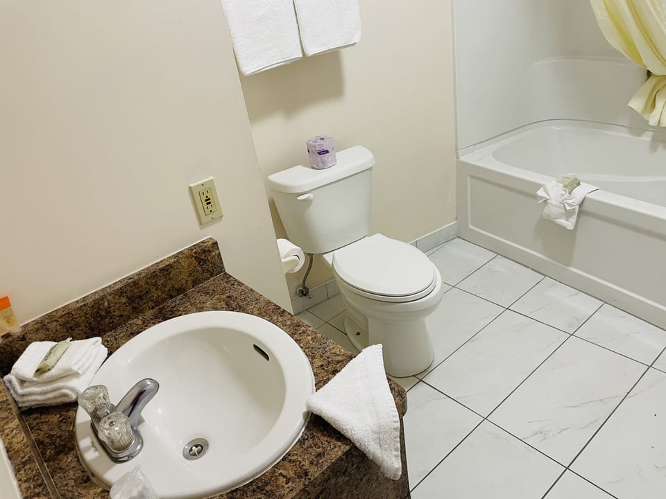 Room, 2 Queen Beds, Non Smoking | Bathroom | Combined shower/tub, free toiletries, towels
