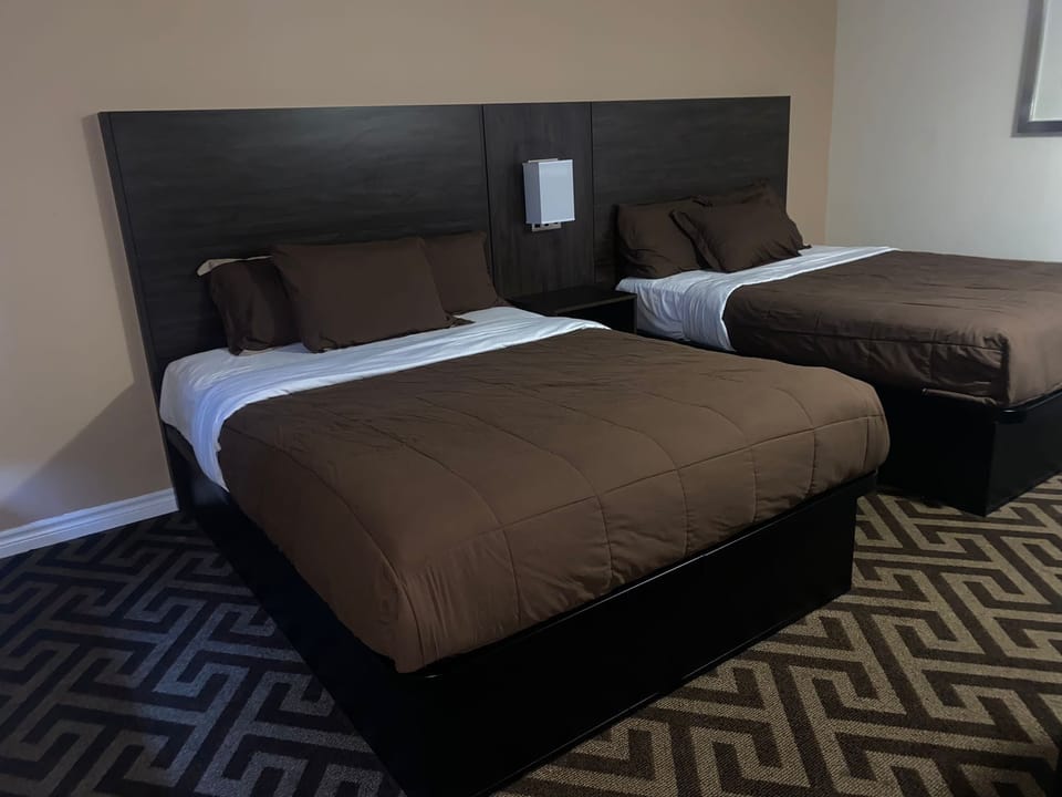 Room, 2 Queen Beds, Non Smoking | Desk, iron/ironing board, free cribs/infant beds, rollaway beds