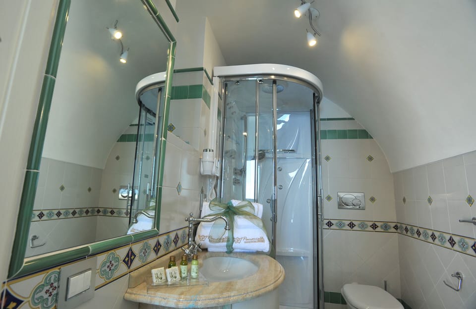 Panoramic Double Room, Sea View | Bathroom | Hydromassage showerhead, designer toiletries, hair dryer, slippers