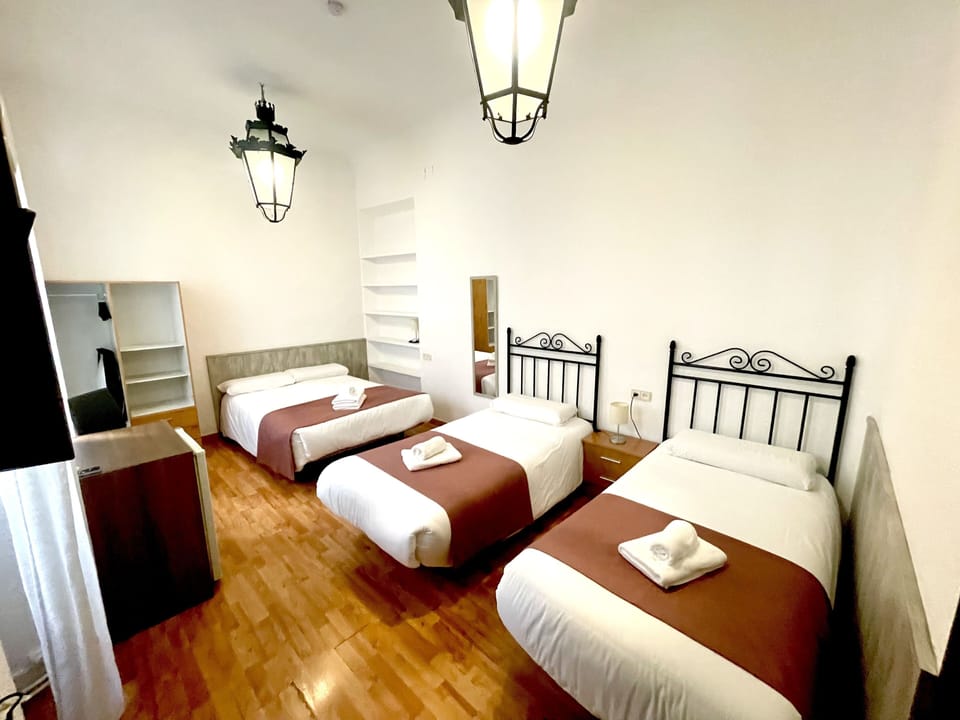 Quadruple Room | Minibar, iron/ironing board, free WiFi, bed sheets
