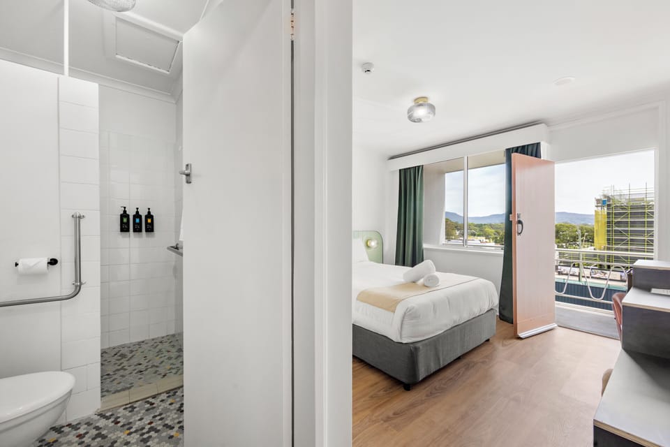 Deluxe Room, 1 Queen Bed, Balcony | Bathroom | Shower, towels, soap, shampoo