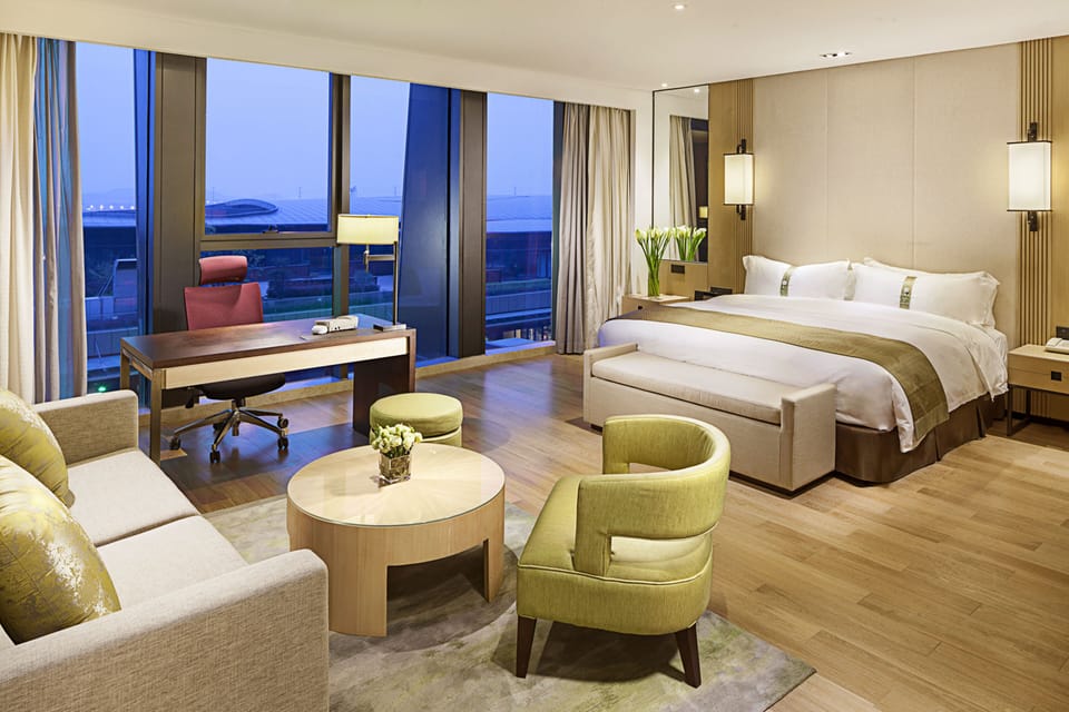 Premium Room, 1 King Bed | Living area | TV, DVD player, pay movies