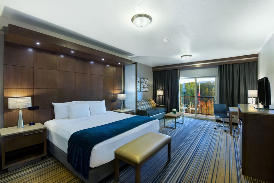 Riverview Balcony King Suite Sleeper Sofa | Premium bedding, desk, laptop workspace, blackout drapes