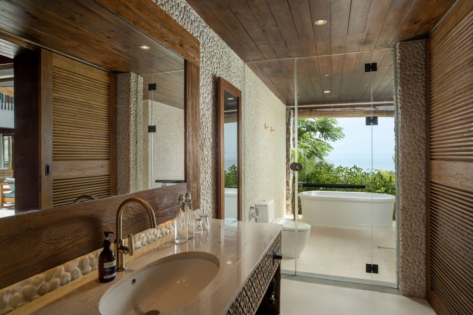 Separate tub and shower, rainfall showerhead, free toiletries