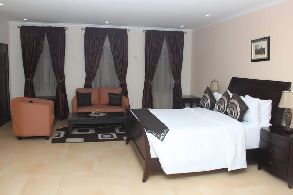 Desk, laptop workspace, bed sheets