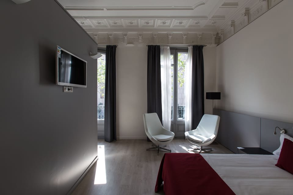 Deluxe Room, Balcony, City View | In-room safe, soundproofing, iron/ironing board, cribs/infant beds