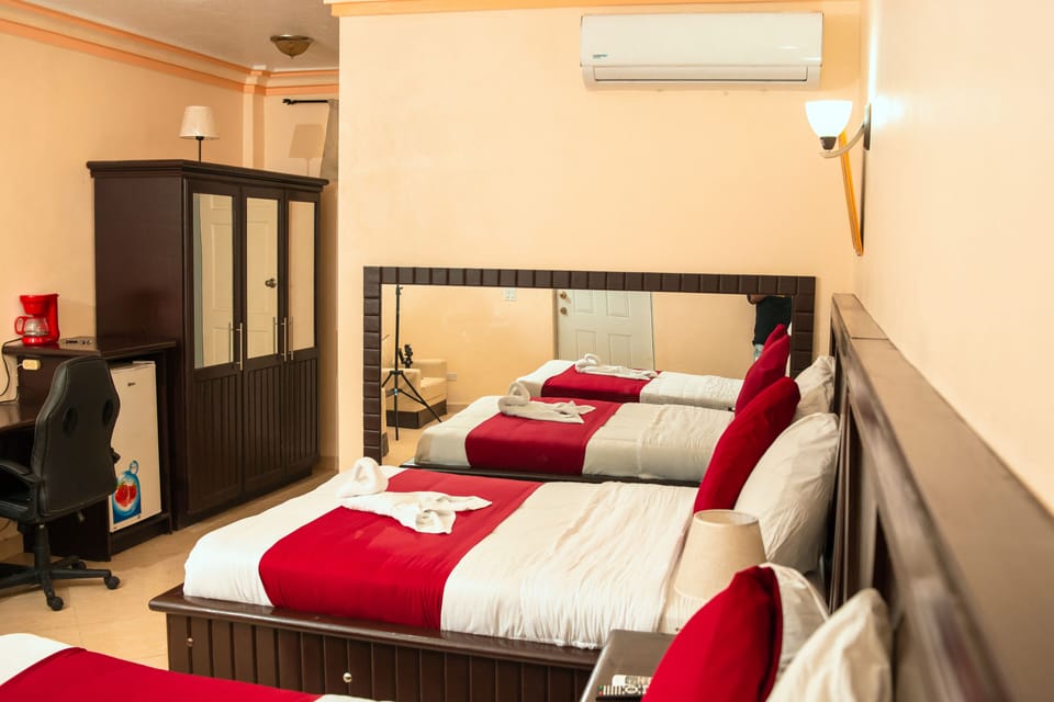 Classic Double Room | Minibar, in-room safe, desk, iron/ironing board
