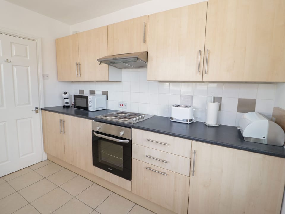 Fridge, electric kettle, toaster, cookware/dishes/utensils