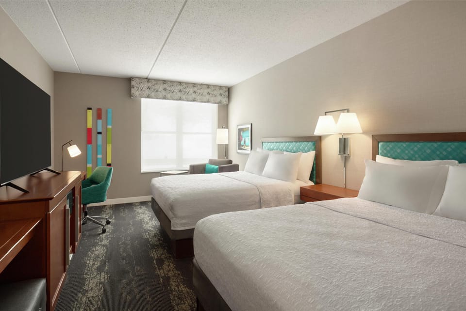 Desk, laptop workspace, blackout drapes, iron/ironing board