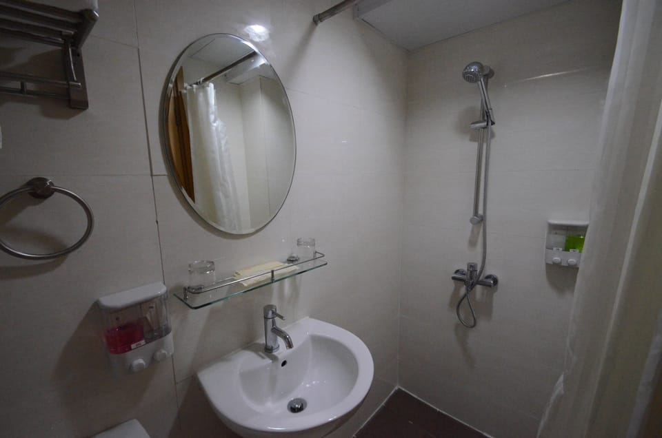 Shower, free toiletries, hair dryer, slippers
