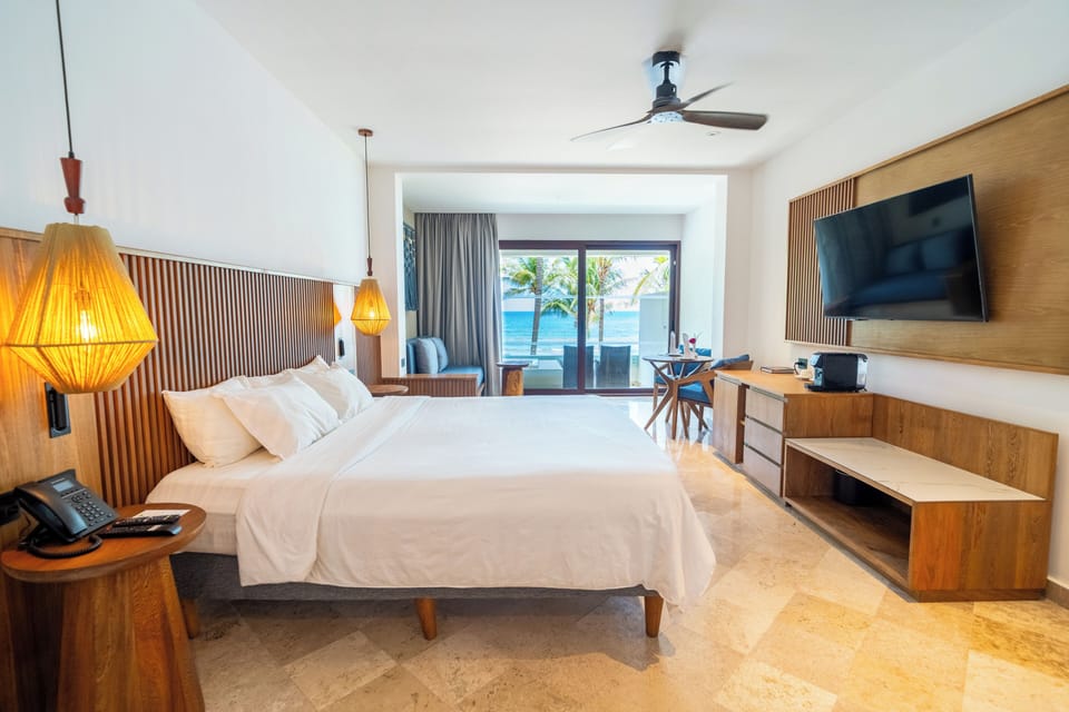 Junior Suite Ocean Front | Minibar (free items), in-room safe, iron/ironing board, WiFi (free)