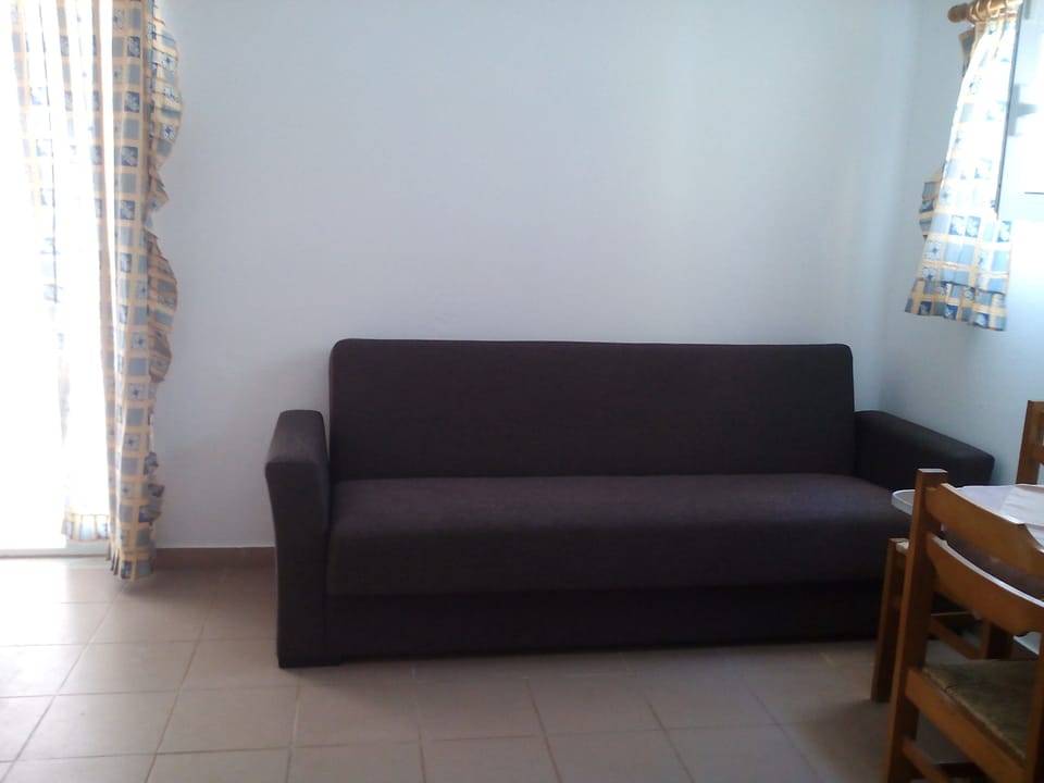 Standard Studio, Balcony, Ground Floor | Living area | 24-inch flat-screen TV with satellite channels, TV
