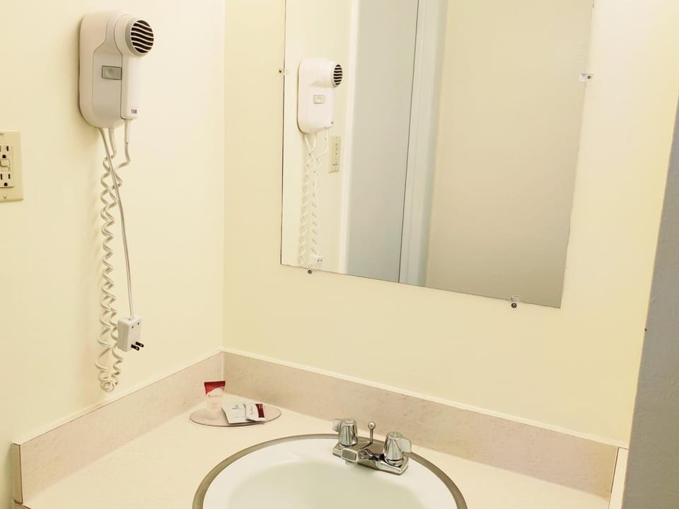 Standard Room, 2 Queen Beds, Non Smoking | Bathroom | Combined shower/tub, free toiletries, hair dryer, towels