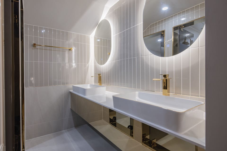 Family Room | Bathroom | Designer toiletries, hair dryer, bathrobes, slippers