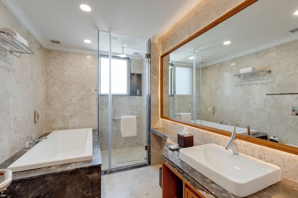 Suite, 1 King Bed | Bathroom | Designer toiletries, hair dryer, bathrobes, slippers