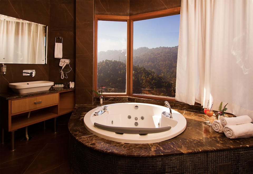 Queen Jacuzzi Suite | Bathroom | Separate tub and shower, rainfall showerhead, free toiletries