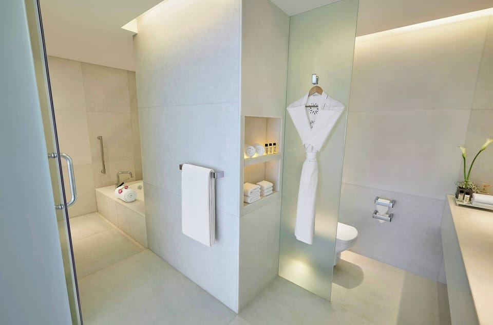 Suite, 2 Bedrooms (Vivanta, Airport View) | Bathroom | Combined shower/tub, deep soaking tub, free toiletries, hair dryer