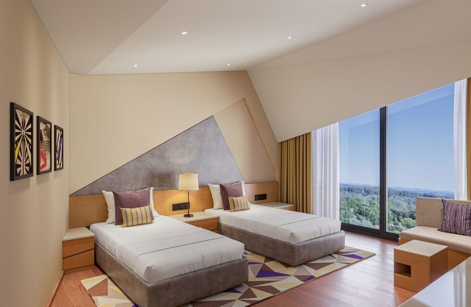 Deluxe Room, 2 Twin Beds (Airport View) | Minibar, in-room safe, desk, laptop workspace