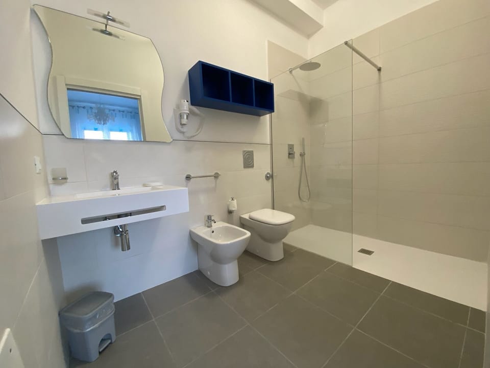 Family Quadruple Room | Bathroom | Shower, rainfall showerhead, eco-friendly toiletries, hair dryer