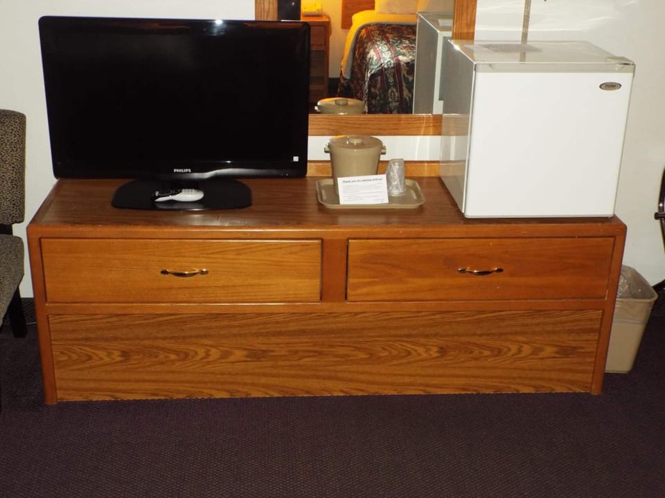 Desk, laptop workspace, blackout drapes, iron/ironing board