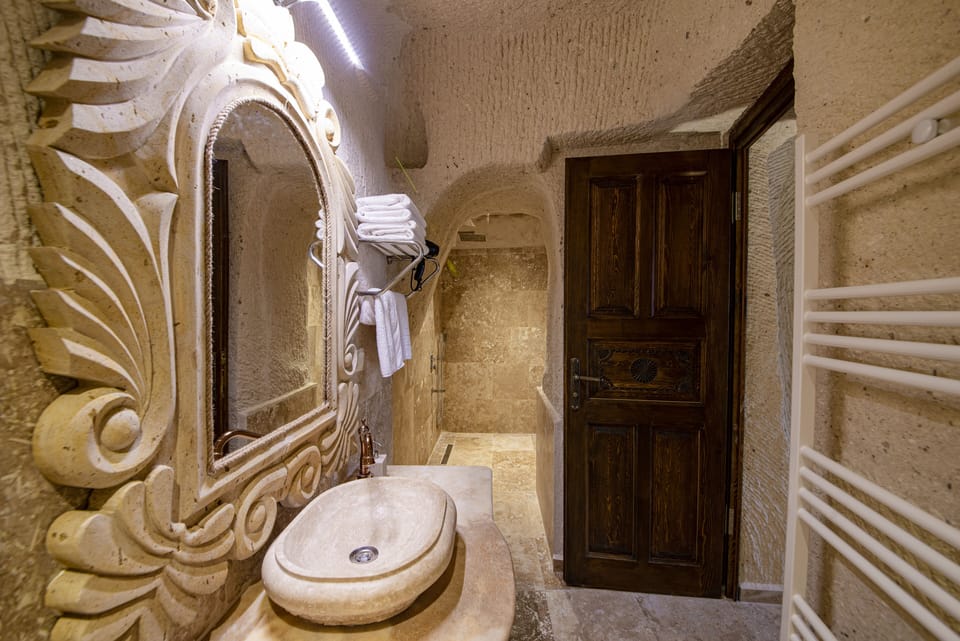 Premier Room | Bathroom | Hair dryer, slippers, towels