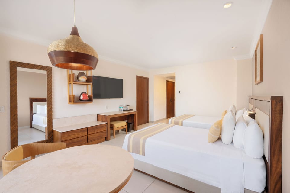 Deluxe Room, Balcony | Free minibar, in-room safe, desk, blackout drapes