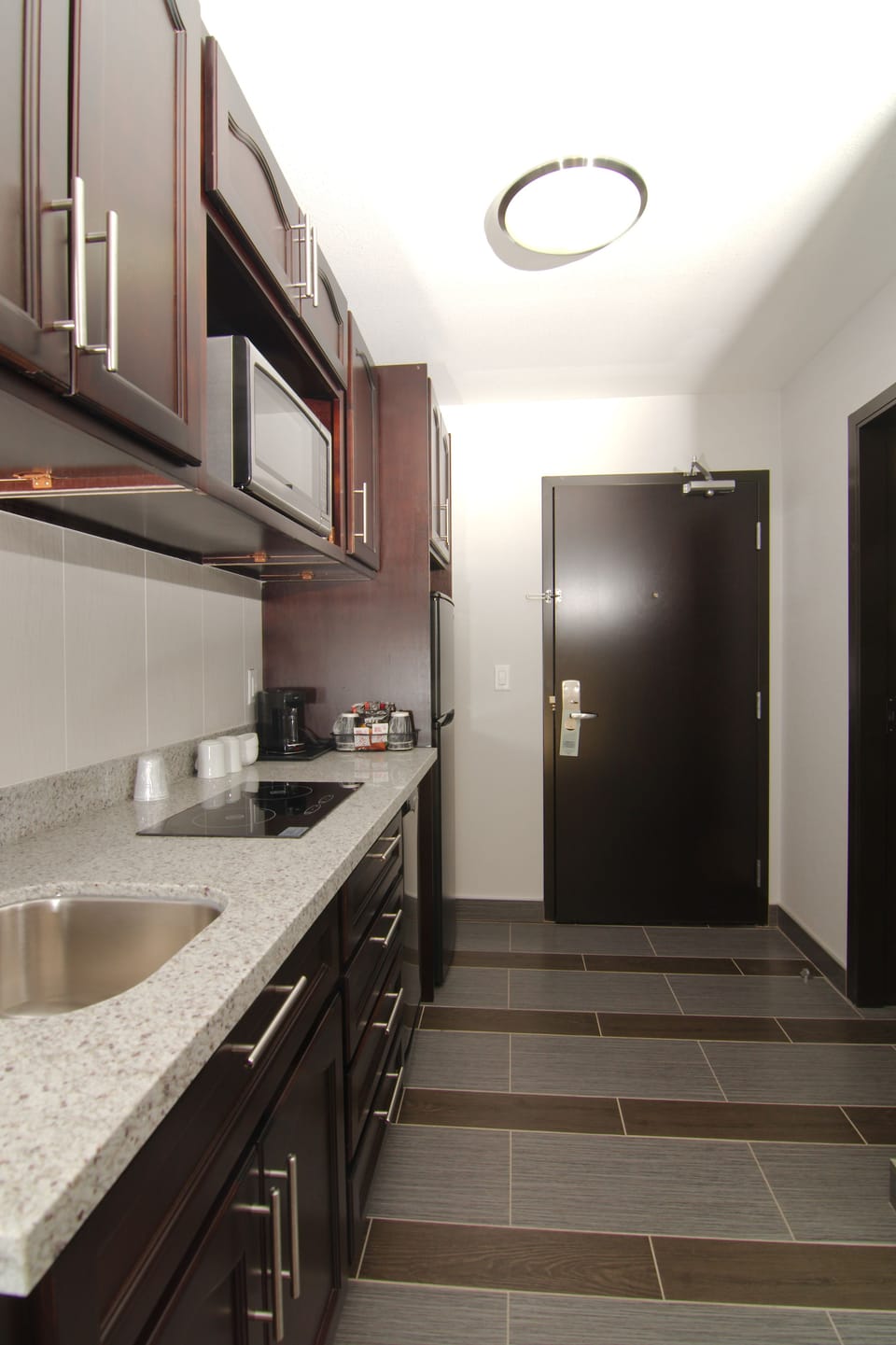 Kitchenette Suite, 1 King Bed | Private kitchenette | Coffee/tea maker, full-size fridge, microwave, stovetop