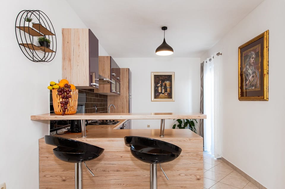 Villa | Private kitchen | Fridge, oven, stovetop, dishwasher
