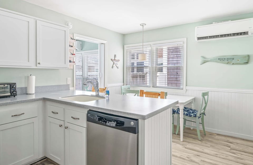 Condo, Multiple Beds, Kitchen (Coastal Condo) | Private kitchen | Fridge, microwave, oven, stovetop