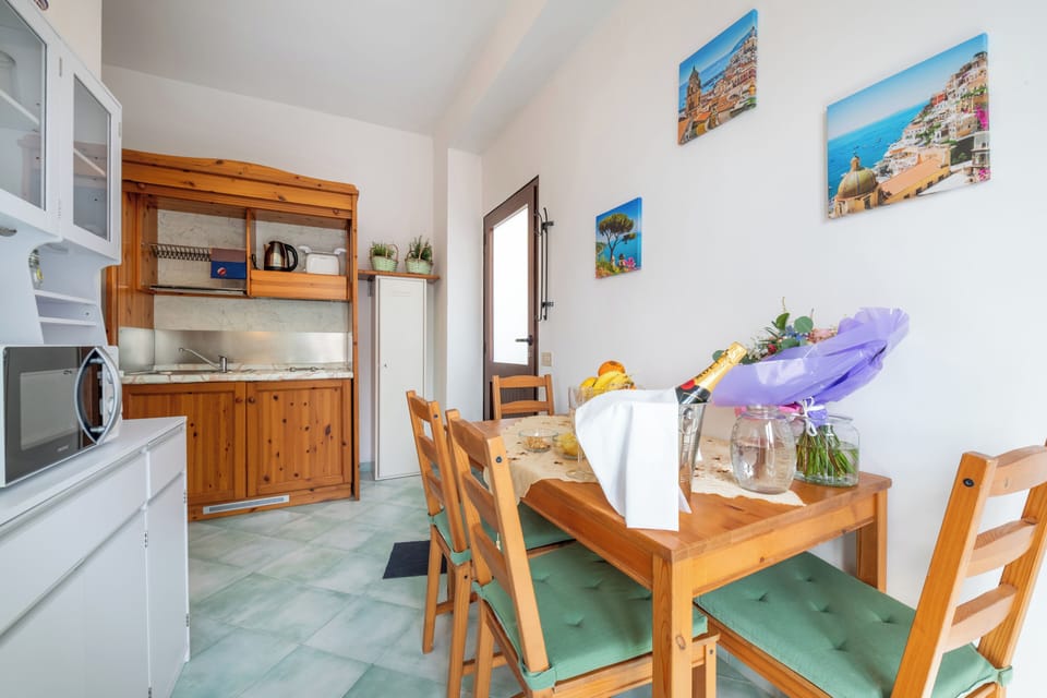 Apartment, Sea View | Private kitchenette | Shared fridge, microwave, electric kettle, highchair